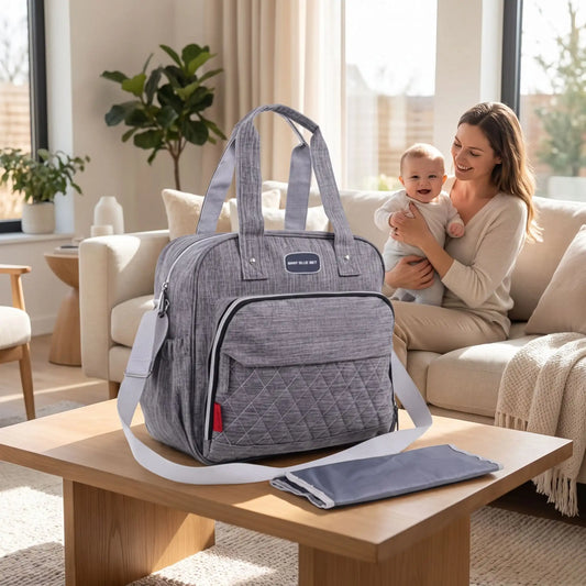 Sac a langer avec tapis de change gris présenté avec son tapis pliable