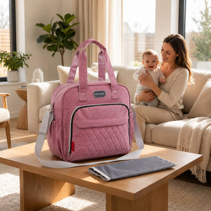 Sac a langer avec tapis de change rose présenté avec son tapis pliable