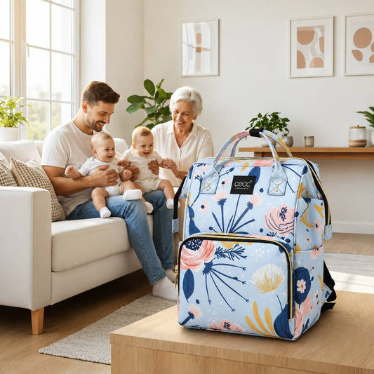 Sac a langer bebe bleu à motif floral grande capacité avec multiples compartiments.