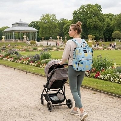 Sac a langer bebe utilisé par une maman avec une poussette lors d'une sortie au parc