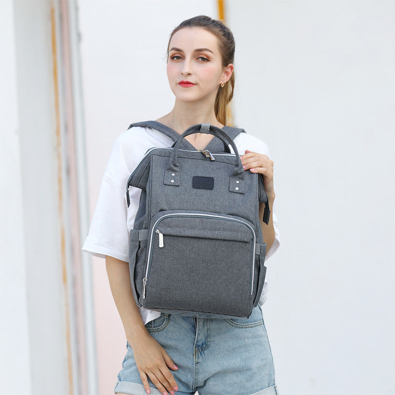sac a langer sac a dos porte de face montrant son design structure