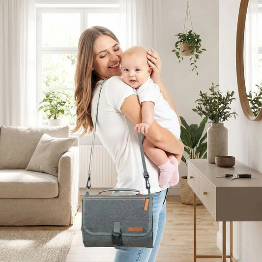 tapis a langer nomade gris compact et pratique pour les sorties avec bebe